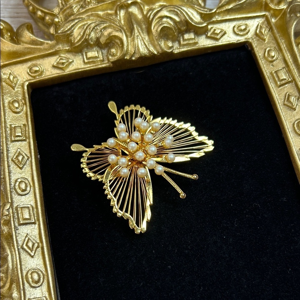 Vintage Monet gold-tone faux pearl butterfly brooch
